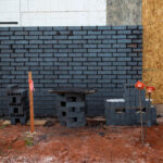 brick siding being installed at retail commercial project