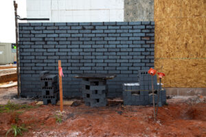 brick siding being installed at retail commercial project