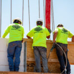 KBA contractors on bracing walkway pouring concrete