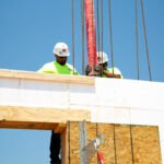 Installer pouring concrete into ICF wall
