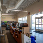 Side angle of product shelves inside of the Sherwin Williams project